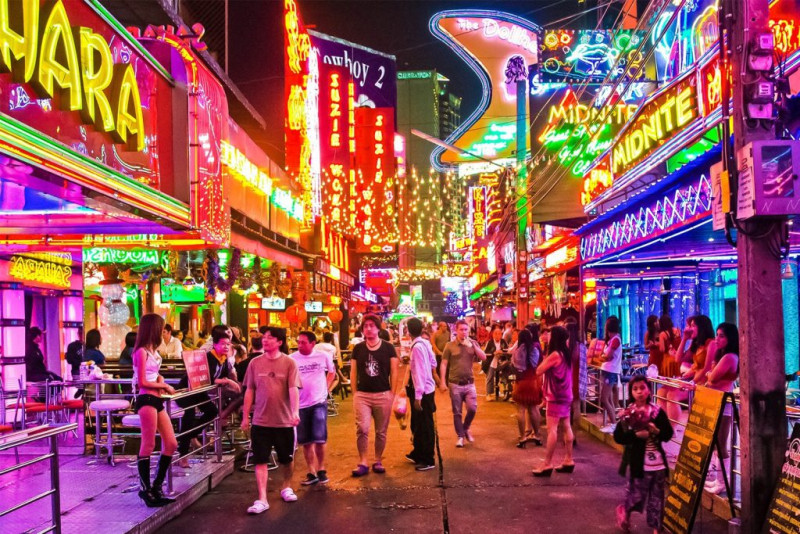 Soi Cowboy red light district neon signs at night